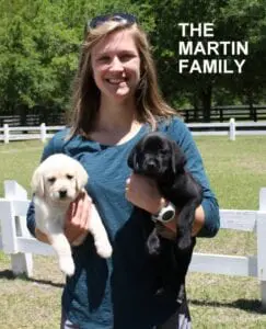 The Martin family and their puppies