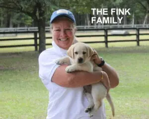 The Fink family and their pup