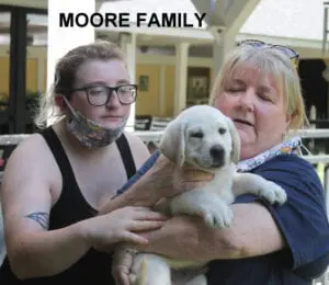 The Moore family and their puppy